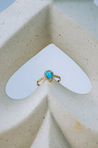 Anillo con gota celeste 10K