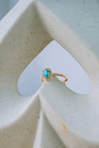 Anillo con gota celeste 10K