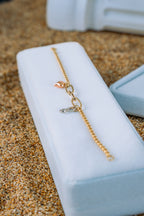 Pulsera vacía con dije infinito y corazón 3 oros 10K