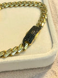 Pulsera Monaco con corazón de piedras negras 10K